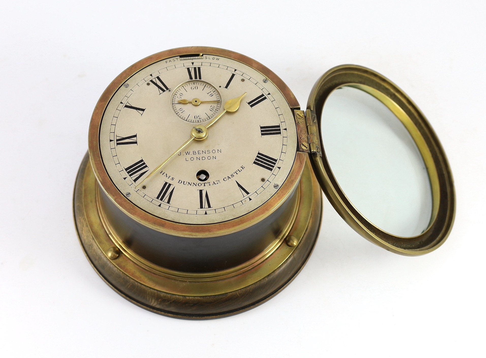 J.W. Benson of London. A brass bulkhead timepiece for HMS Dunnottar Castle, 22cm diameter